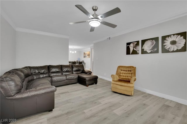 2080 Karen Ave Unit 1, Las Vegas, NV 89169 - living room with wood finished floors, ornamental molding, a chandelier, ceiling fan, and baseboards