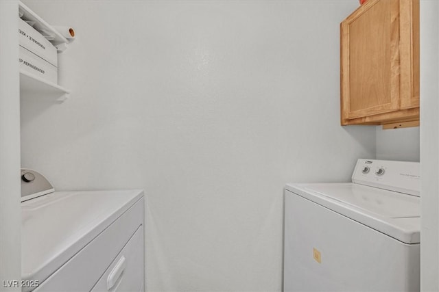 950 Seven Hills Dr Unit 116, Henderson, NV 89052 - clothes washing area with washer and dryer and cabinet space