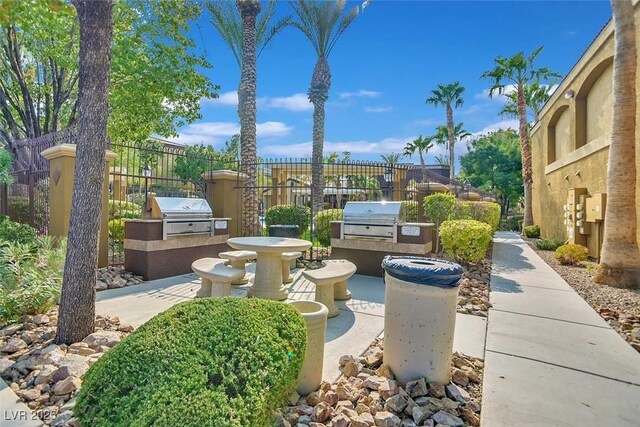 950 Seven Hills Dr Unit 116, Henderson, NV 89052 - view of patio / terrace with area for grilling, a grill, and fence