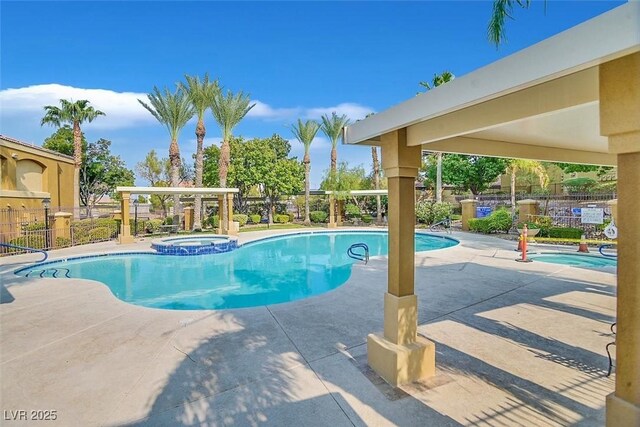 950 Seven Hills Dr Unit 116, Henderson, NV 89052 - community pool featuring fence, a hot tub, and a patio