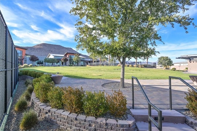 10150 Emerald Sunset Ct, Las Vegas, NV 89148 - surrounding community with a yard and a mountain view