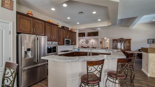 kitchen featuring dark wood finished floors, visible vents, appliances with stainless steel finishes, and recessed lighting