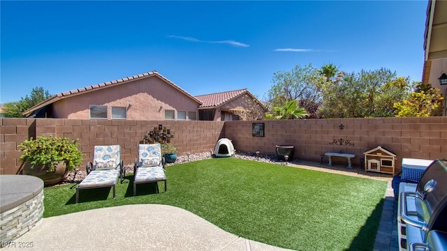 view of yard with a fenced backyard and a patio area