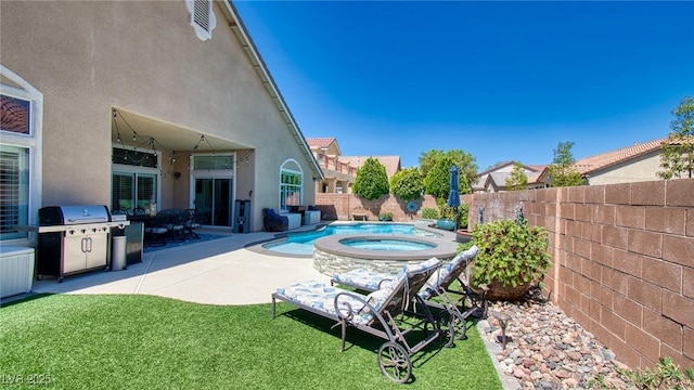 view of pool featuring a patio area, a fenced backyard, a lawn, an in ground hot tub, and grilling area