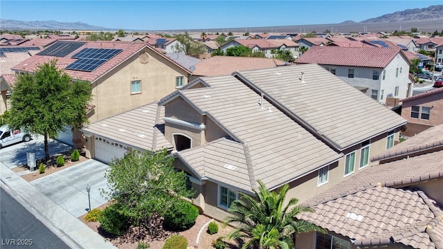 aerial view featuring a mountain view and a residential view