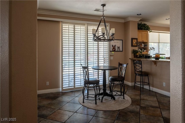 dining area featuring baseboards, visible vents, a chandelier, crown molding, and dark tile patterned flooring