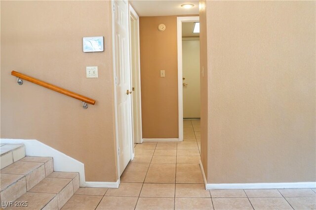 9704 Falling Star Ave, Las Vegas, NV 89117 - hallway with light tile patterned floors, baseboards, and stairs