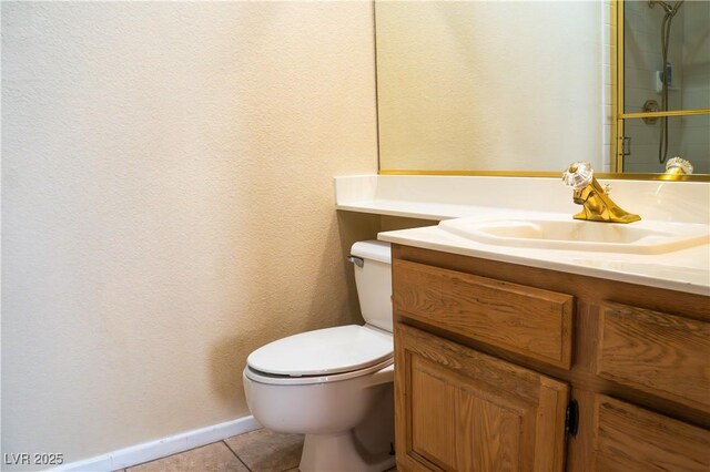 9704 Falling Star Ave, Las Vegas, NV 89117 - bathroom with vanity, toilet, tile patterned floors, baseboards, and a shower