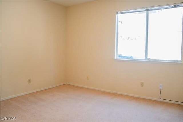 9704 Falling Star Ave, Las Vegas, NV 89117 - spare room with light carpet and baseboards