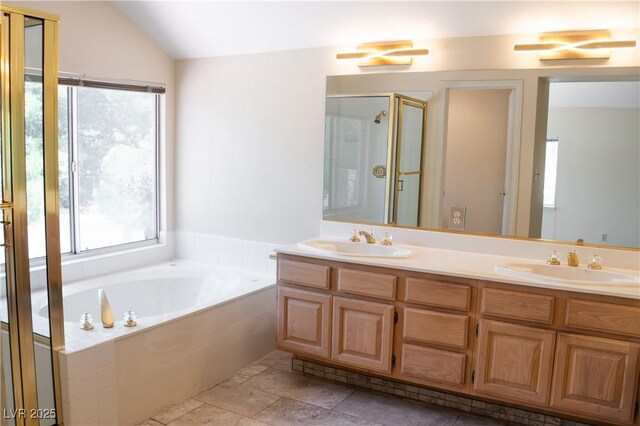 9704 Falling Star Ave, Las Vegas, NV 89117 - full bath featuring healthy amount of natural light, double vanity, a bath, and lofted ceiling