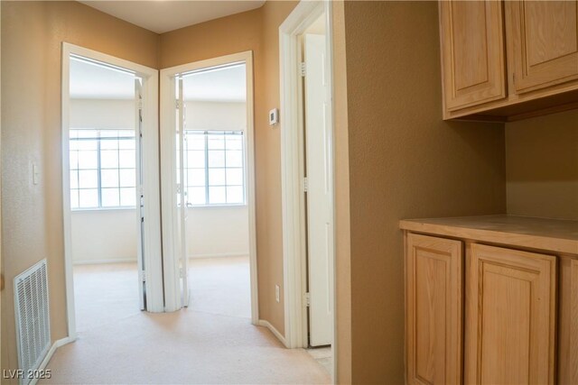 9704 Falling Star Ave, Las Vegas, NV 89117 - hallway featuring light colored carpet