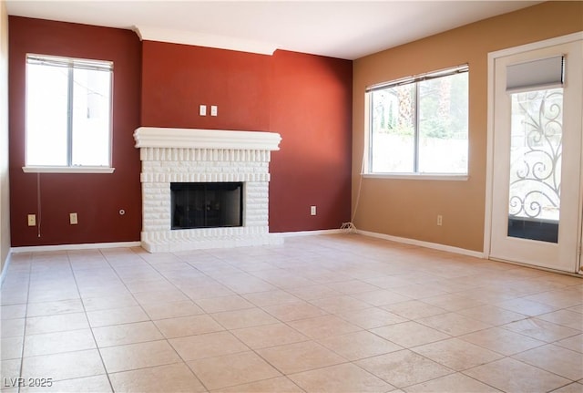 9704 Falling Star Ave, Las Vegas, NV 89117 - unfurnished living room featuring plenty of natural light, light tile patterned floors, and a fireplace