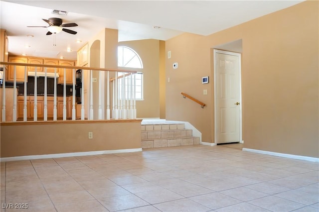 9704 Falling Star Ave, Las Vegas, NV 89117 - spare room featuring light tile patterned floors, a ceiling fan, stairway, and baseboards