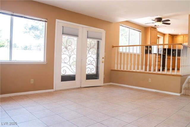 9704 Falling Star Ave, Las Vegas, NV 89117 - entryway with light tile patterned floors, ceiling fan, and baseboards