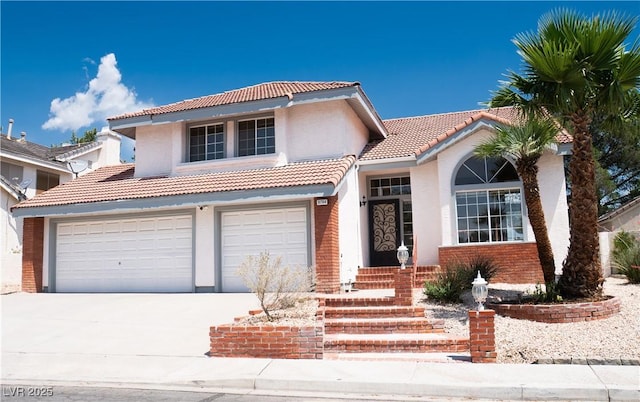 9704 Falling Star Ave, Las Vegas, NV 89117 - view of front facade with a tile roof, driveway, a garage, stucco siding, and brick siding