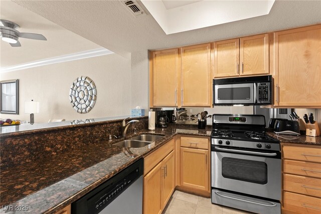 220 E Flamingo Rd Unit 111, Las Vegas, NV 89169 - kitchen with appliances with stainless steel finishes, a sink, light brown cabinets, crown molding, and ceiling fan