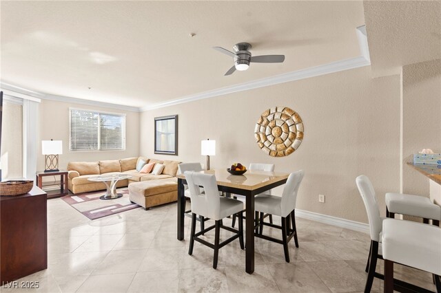 220 E Flamingo Rd Unit 111, Las Vegas, NV 89169 - dining room featuring ornamental molding, a ceiling fan, light tile patterned flooring, and baseboards
