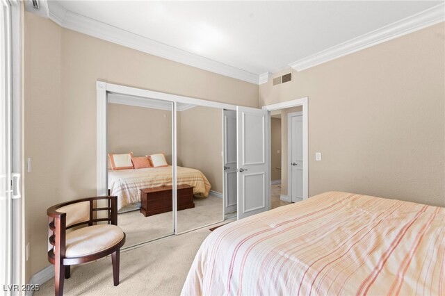 220 E Flamingo Rd Unit 111, Las Vegas, NV 89169 - carpeted bedroom featuring ornamental molding, a closet, and baseboards
