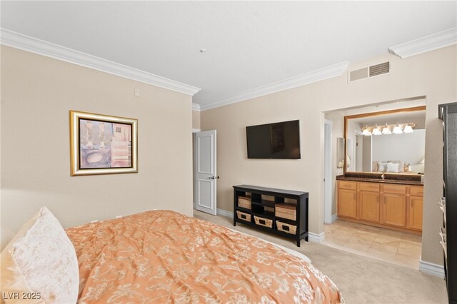 220 E Flamingo Rd Unit 111, Las Vegas, NV 89169 - bedroom with crown molding, light carpet, baseboards, ensuite bath, and a sink
