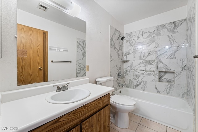 bathroom featuring tile patterned floors, toilet, visible vents, shower / washtub combination, and vanity