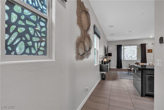 397 Purple Sandpiper St, Las Vegas, NV 89138 - hallway with tile patterned flooring and baseboards