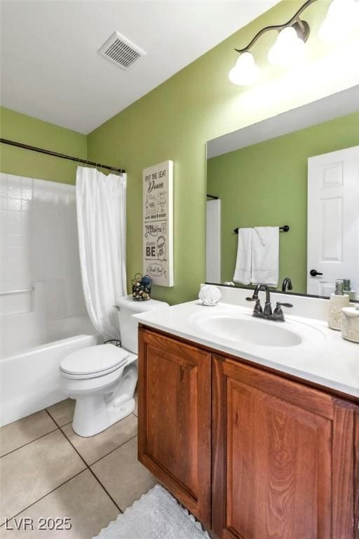 bathroom with tile patterned floors, vanity, toilet, and shower / tub combo