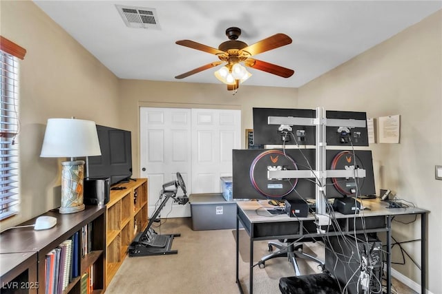 office with ceiling fan, carpet flooring, and plenty of natural light