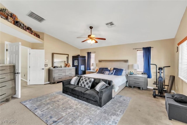 bedroom with light carpet, lofted ceiling, baseboards, and ceiling fan