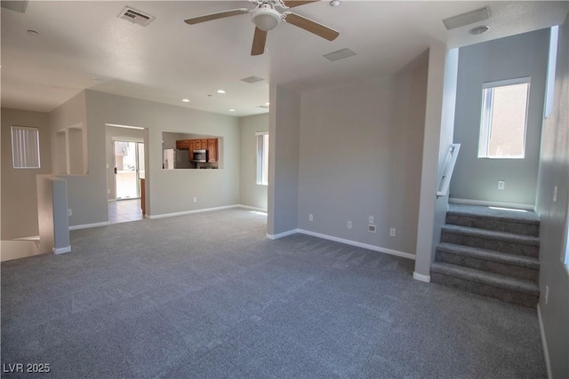 6652 Weeping Pine St, Las Vegas, NV 89149 - unfurnished living room featuring carpet flooring, ceiling fan, baseboards, stairway, and recessed lighting