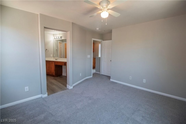 6652 Weeping Pine St, Las Vegas, NV 89149 - unfurnished bedroom with light carpet, baseboards, ensuite bath, and a ceiling fan