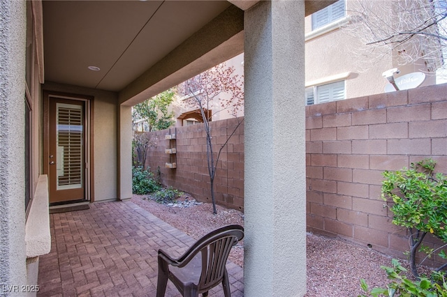 view of patio / terrace featuring fence