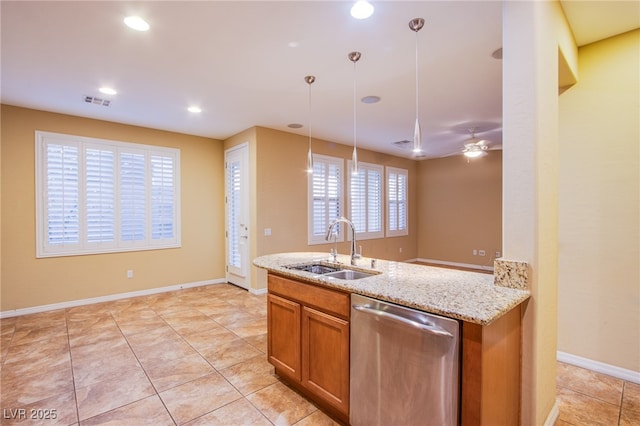 kitchen featuring stainless steel dishwasher, light stone counters, a sink, brown cabinets, and recessed lighting