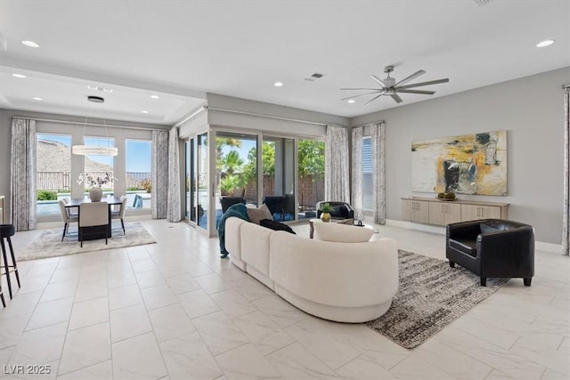 2910 Raywood Ash Dr, Las Vegas, NV 89138 - living room with ceiling fan, marble finish floor, visible vents, and recessed lighting