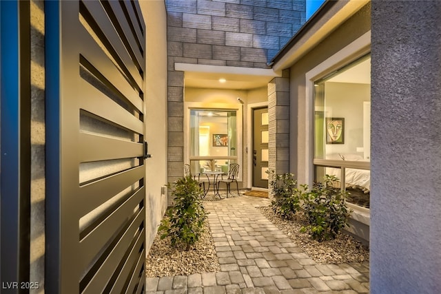 2910 Raywood Ash Dr, Las Vegas, NV 89138 - doorway to property featuring covered porch and stucco siding