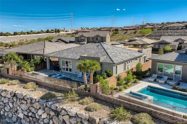2910 Raywood Ash Dr, Las Vegas, NV 89138 - back of property with stucco siding, a fenced backyard, a residential view, and a patio