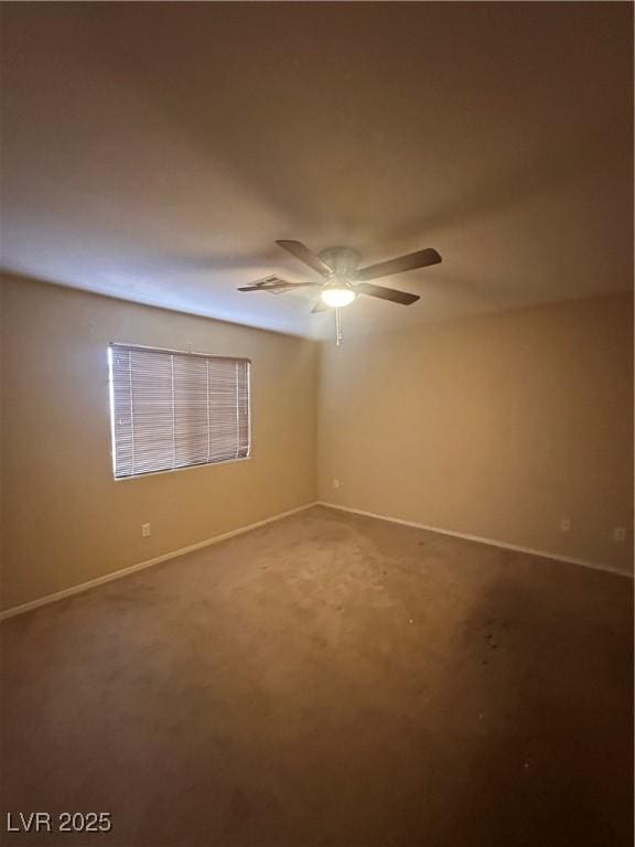 empty room with carpet flooring, baseboards, and ceiling fan