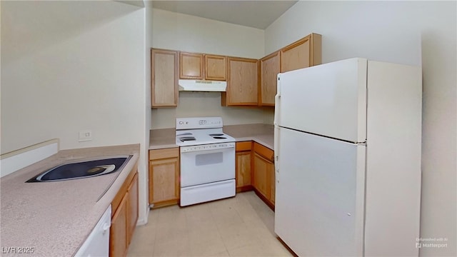 kitchen with light countertops, white appliances, light floors, light brown cabinets, and under cabinet range hood
