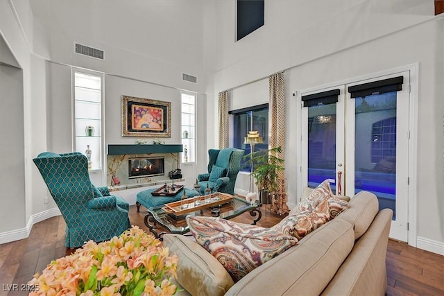 1201 Mersault Ct, Las Vegas, NV 89144 - living room with wood-type flooring, visible vents, and a fireplace