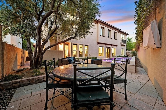 1201 Mersault Ct, Las Vegas, NV 89144 - view of patio featuring a fenced backyard, an outdoor pool, and outdoor dining space