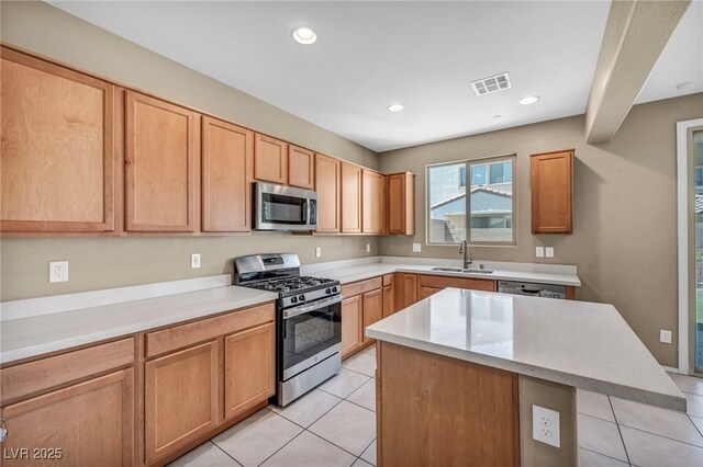kitchen with light tile patterned floors, visible vents, a sink, and appliances with stainless steel finishes