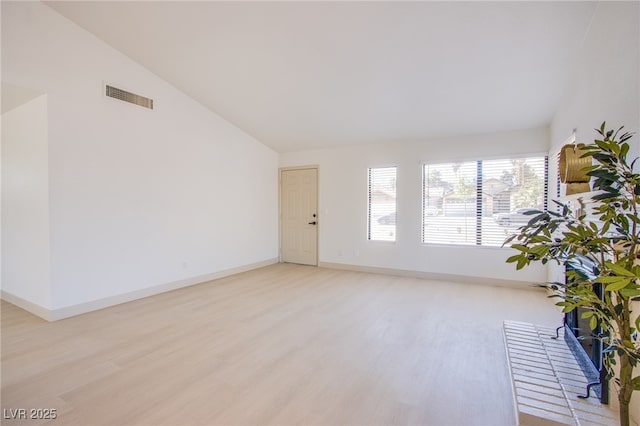 3118 Floral Vista Ave, Henderson, NV 89014 - unfurnished living room with light wood-style floors, lofted ceiling, visible vents, and baseboards