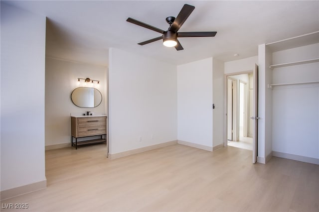 3118 Floral Vista Ave, Henderson, NV 89014 - unfurnished bedroom with light wood-type flooring, a ceiling fan, baseboards, and a closet
