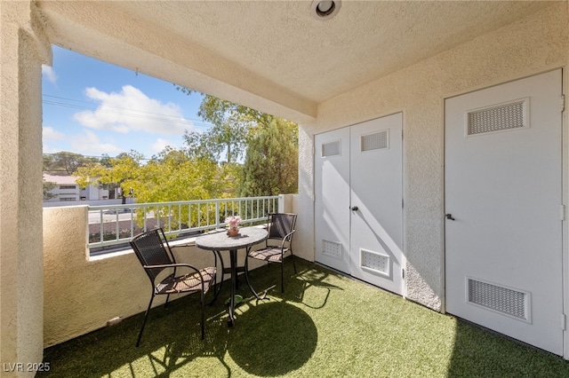 balcony featuring visible vents