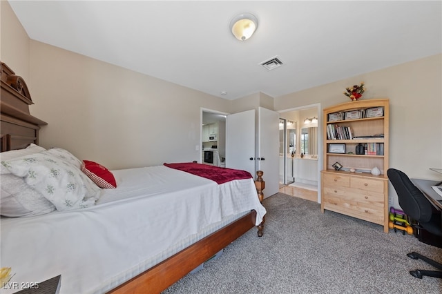 carpeted bedroom featuring visible vents, ensuite bathroom, and french doors