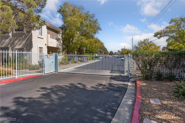 view of gate with fence