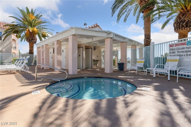 view of pool with fence and a patio