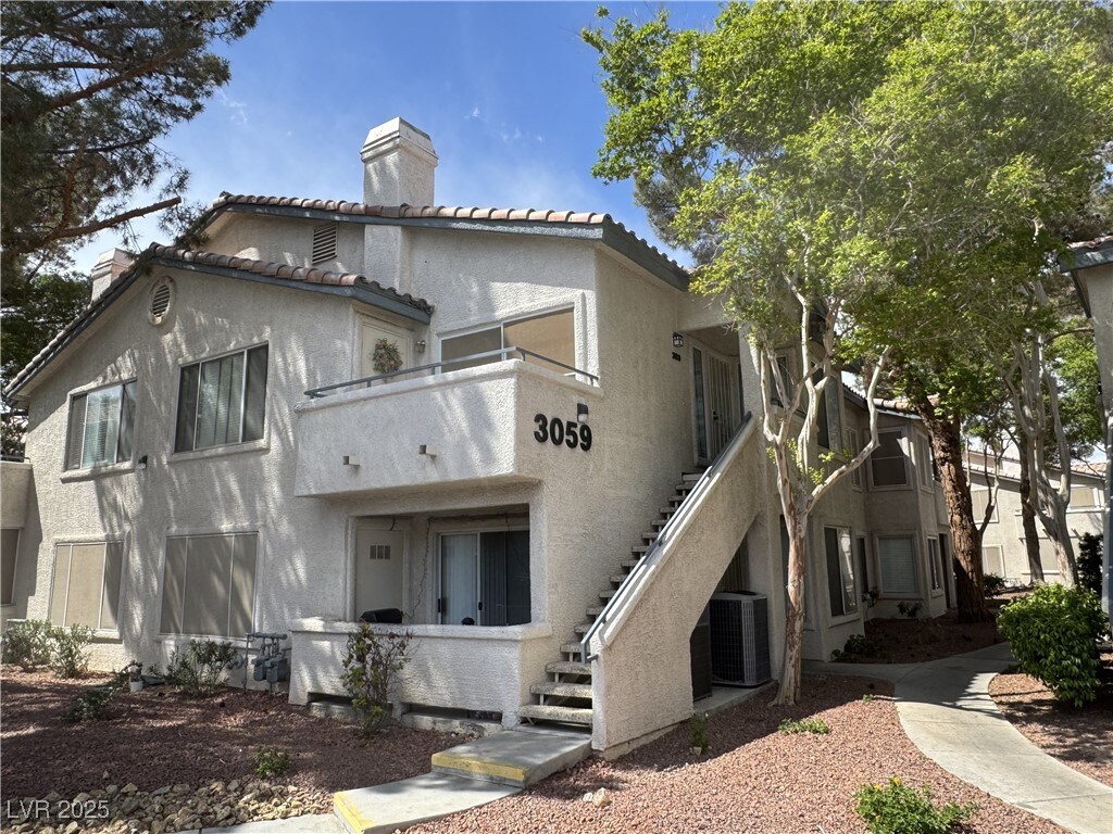 3059 Key Largo Dr Unit 203, Las Vegas, NV 89120 - view of property with central AC and stairway