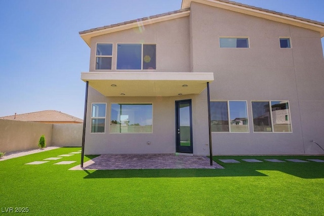 6294 Redstone Hills Dr, Las Vegas, NV 89148 - back of house featuring a patio, a lawn, fence, and stucco siding