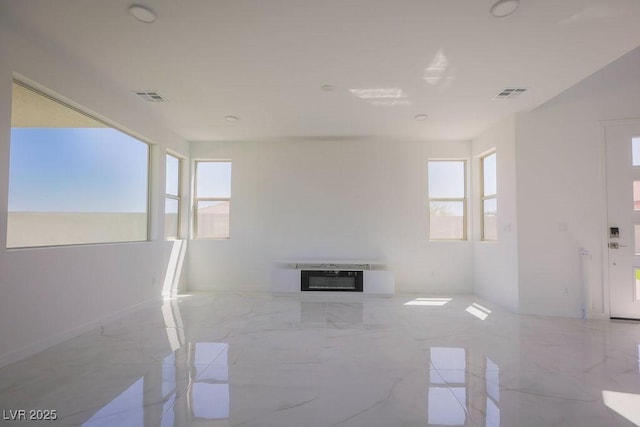 6294 Redstone Hills Dr, Las Vegas, NV 89148 - spare room featuring a wealth of natural light, marble finish floor, and visible vents