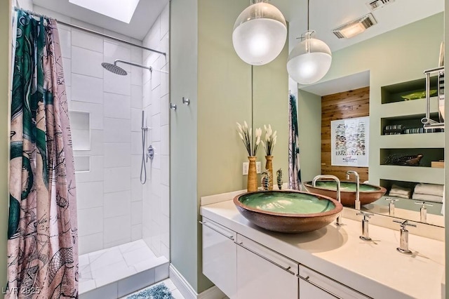 8525 W Verde Way, Las Vegas, NV 89149 - full bath with a tile shower, vanity, and wooden walls